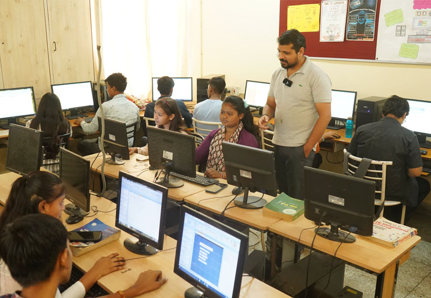 Children attending computer training as part of skills training at Loyola Vocational Institute a partner of JRDS - Development Programs