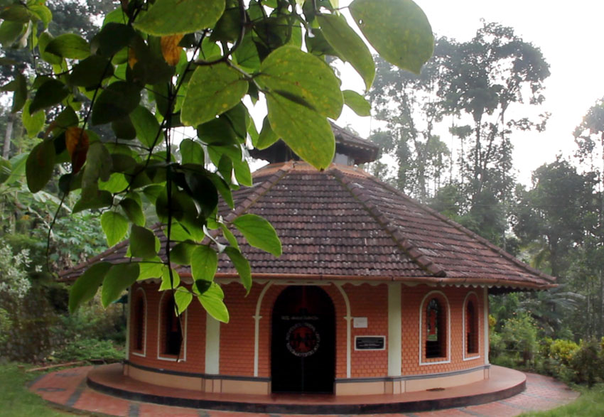 An eco friendly building admist lush greenery in a tribal village at Wayanad