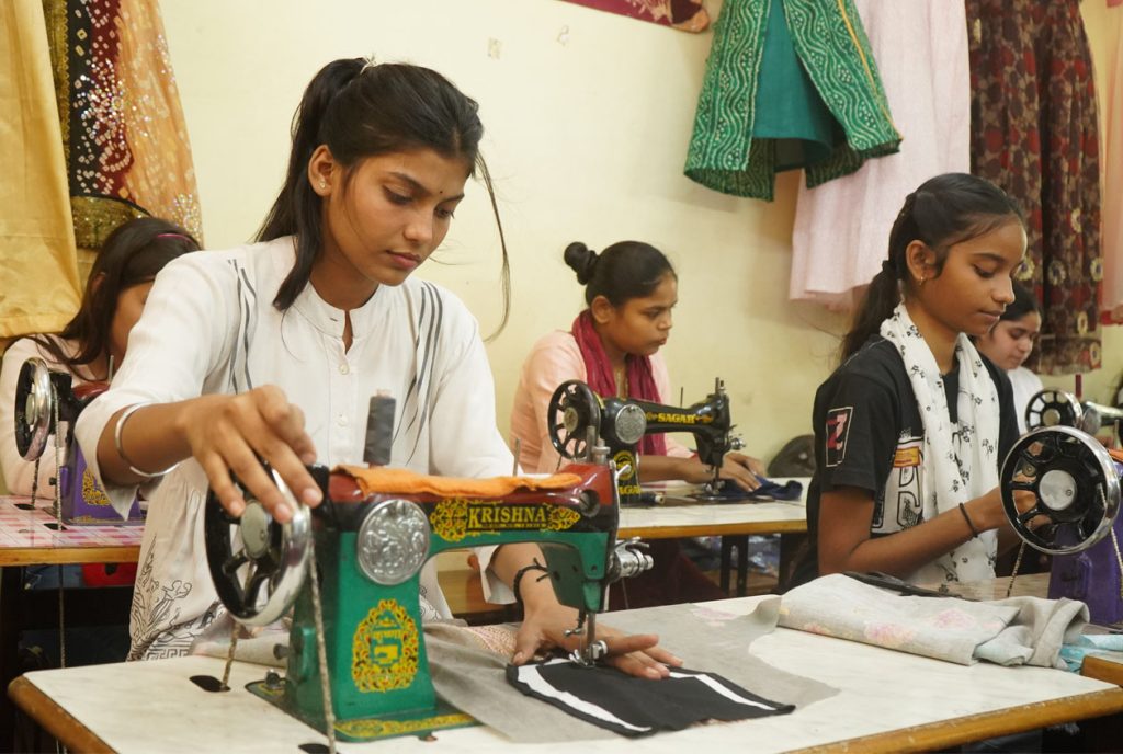 Students of Loyola Vovational Institute a partner of JRDS - Development Programs attending skills training in tailoring