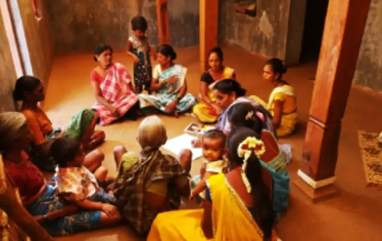 Women having meet as part of social protection group meeting